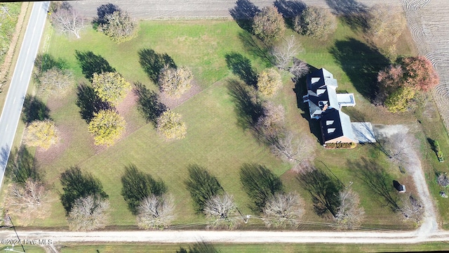 birds eye view of property with a rural view