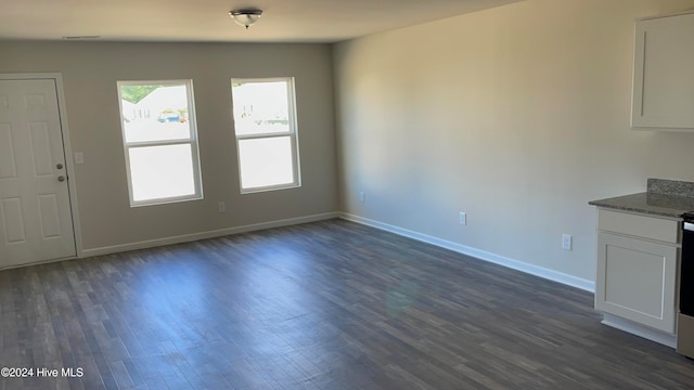 interior space with dark hardwood / wood-style floors