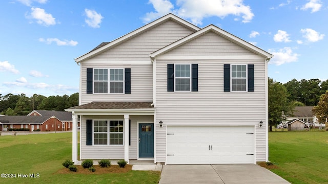 view of front property featuring a garage and a front yard