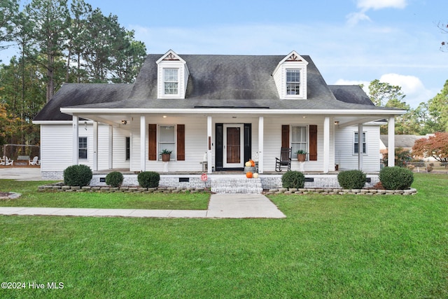 view of front facade featuring covered porch and a front lawn