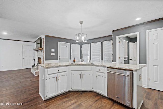 kitchen featuring pendant lighting, white cabinets, stainless steel dishwasher, a fireplace, and dark hardwood / wood-style flooring