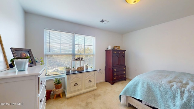 bedroom with light colored carpet