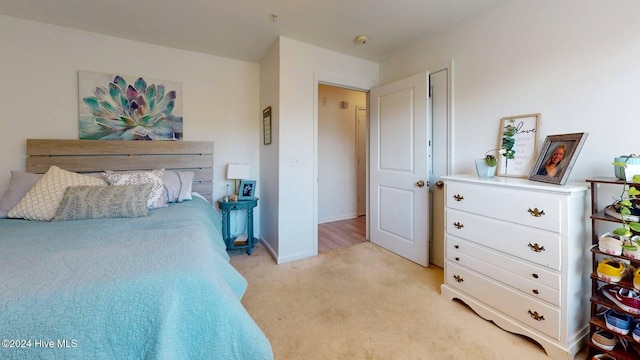 bedroom with light colored carpet