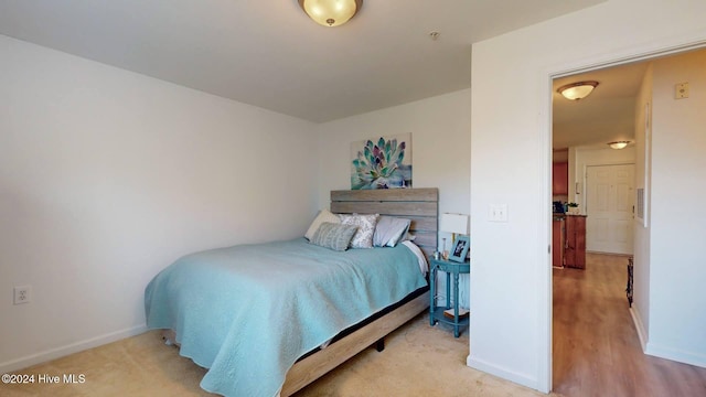 bedroom with light hardwood / wood-style flooring