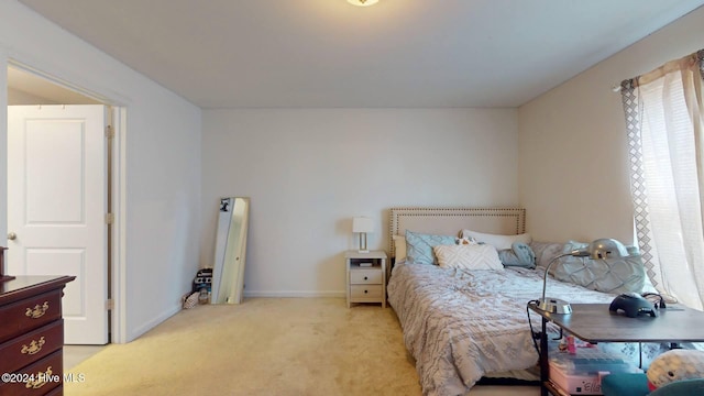 bedroom with light carpet