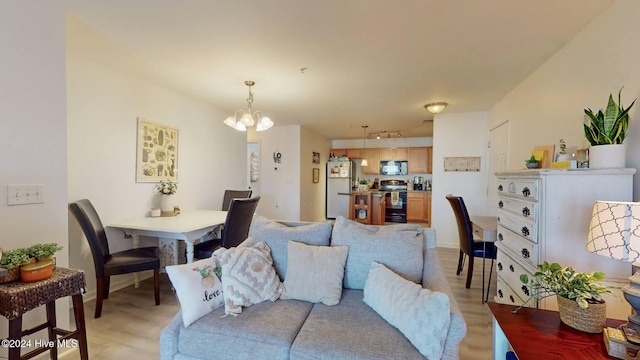 living room featuring an inviting chandelier