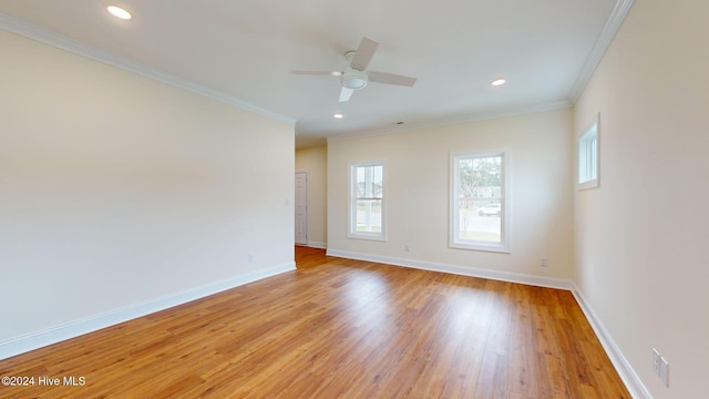 spare room featuring ceiling fan, light hardwood / wood-style floors, and crown molding