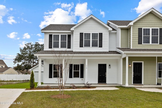 view of front of house with a front lawn and covered porch