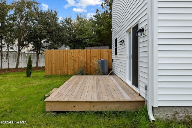 wooden deck with a yard