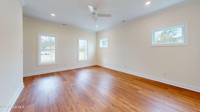 spare room featuring crown molding, light hardwood / wood-style flooring, and ceiling fan