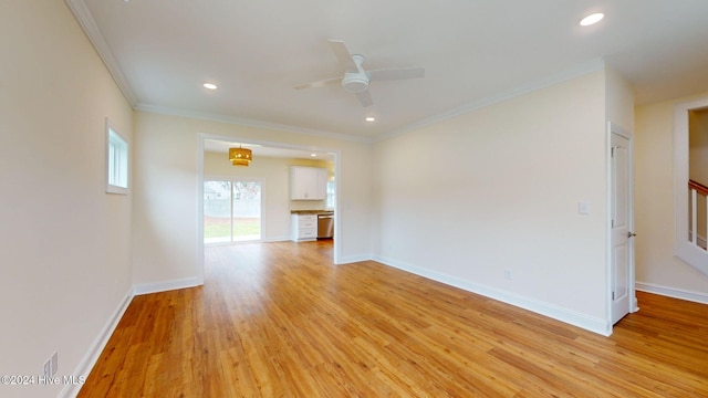 unfurnished living room featuring ceiling fan, light hardwood / wood-style floors, and ornamental molding