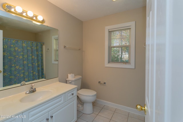 bathroom with a shower with shower curtain, vanity, a textured ceiling, tile patterned flooring, and toilet