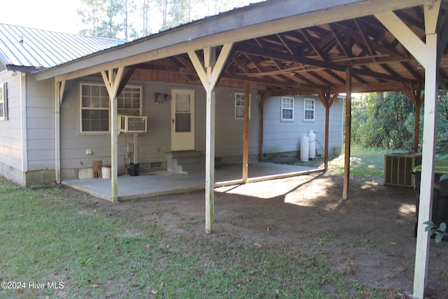 exterior space with cooling unit, a patio, and central AC unit