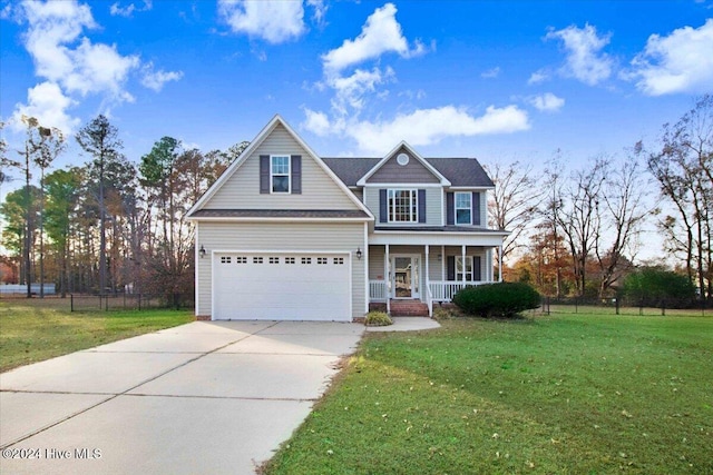 view of front of property featuring a garage, covered porch, and a front lawn