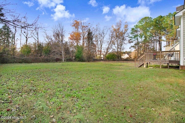 view of yard featuring a wooden deck