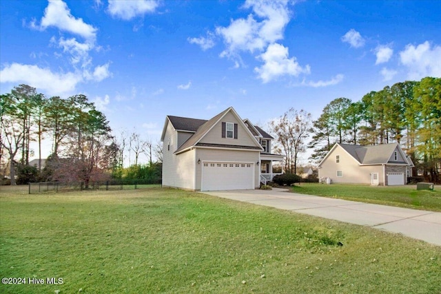 view of side of home with a yard and a garage