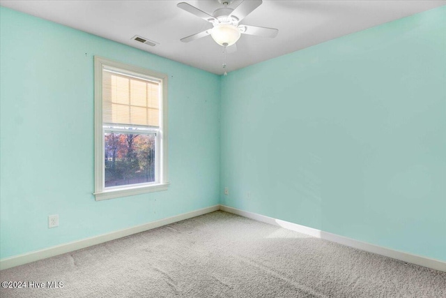 empty room featuring ceiling fan and carpet floors