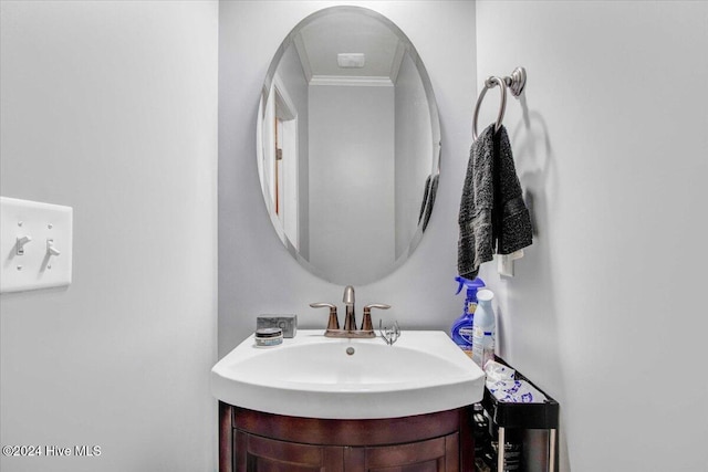 bathroom with vanity and crown molding