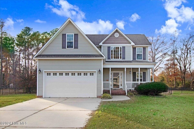 view of front of house with a front lawn, a porch, and a garage