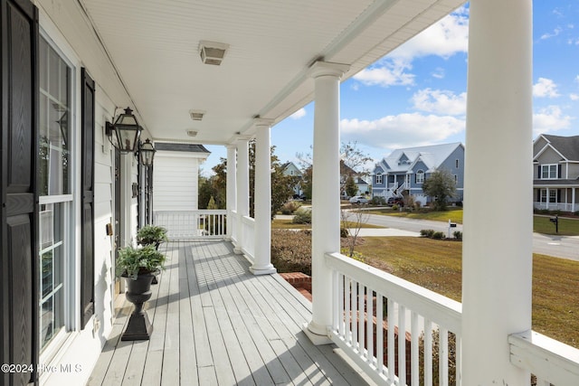 wooden terrace featuring a porch