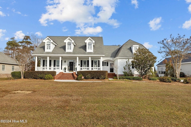 1502 Marsh Pointe, Morehead City, NC 28557 - cape cod-style house with covered porch, a front lawn, and a shingled roof