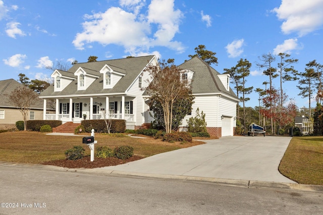 1502 Marsh Pointe, Morehead City, NC 28557 - cape cod home with driveway, covered porch, a front yard, and an attached garage