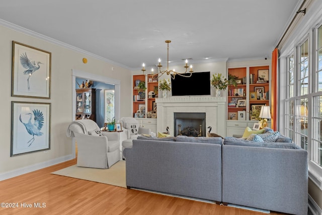 1502 Marsh Pointe, Morehead City, NC 28557 - living room with wood finished floors, a chandelier, crown molding, a brick fireplace, and built in features