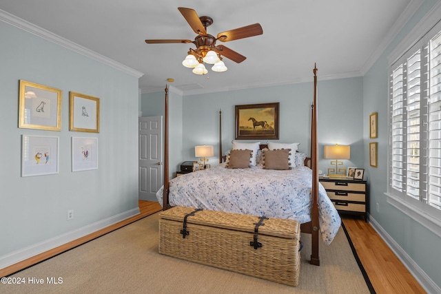 bedroom with ceiling fan, ornamental molding, and light hardwood / wood-style flooring