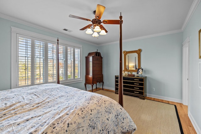 1502 Marsh Pointe, Morehead City, NC 28557 - bedroom featuring wood finished floors, ornamental molding, and a ceiling fan
