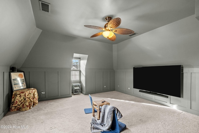 bedroom with ceiling fan, light carpet, and vaulted ceiling