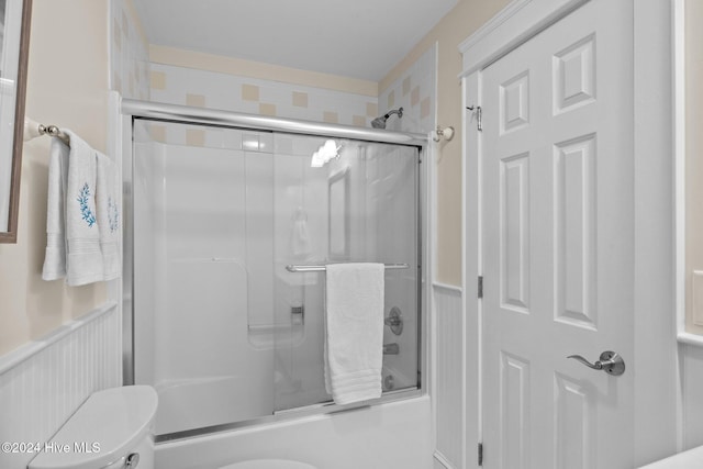 1502 Marsh Pointe, Morehead City, NC 28557 - bathroom with enclosed tub / shower combo and wainscoting