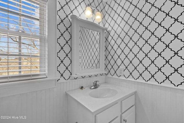 1502 Marsh Pointe, Morehead City, NC 28557 - bathroom with vanity, wainscoting, and wallpapered walls