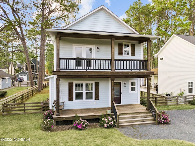 view of front facade featuring a front yard and a porch