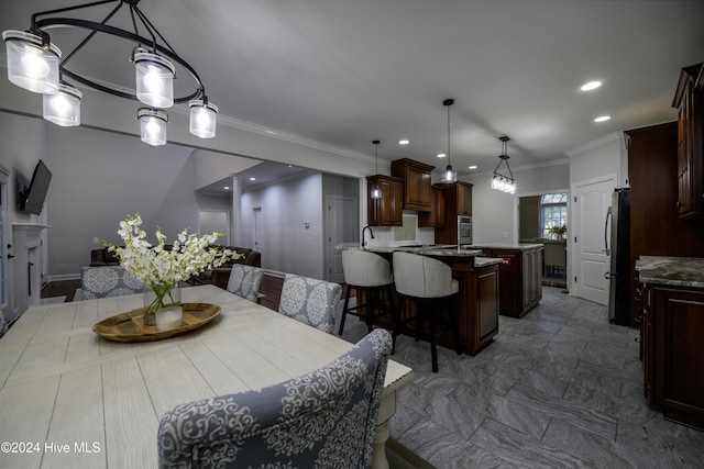 dining room featuring crown molding