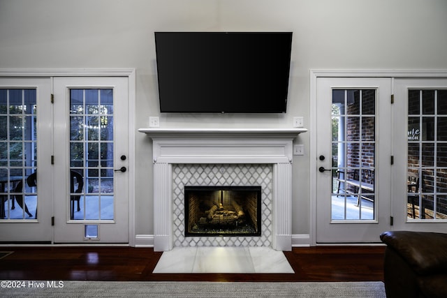 living room featuring a fireplace and dark hardwood / wood-style floors