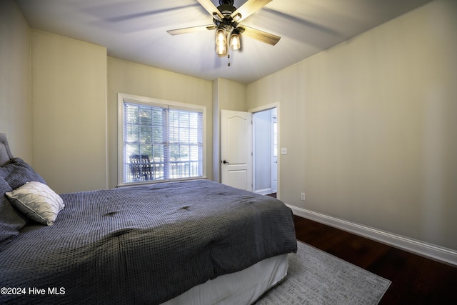 bedroom with ceiling fan and wood-type flooring