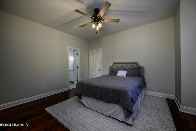 bedroom with ceiling fan, dark hardwood / wood-style floors, and ensuite bathroom