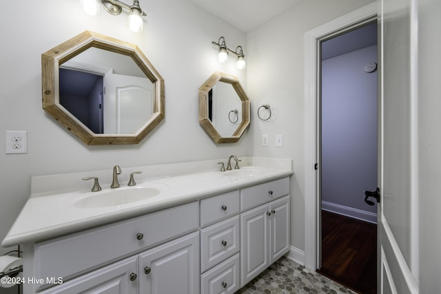 bathroom featuring tile patterned flooring and vanity