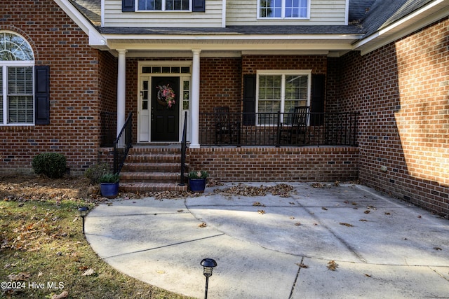 doorway to property with a patio area