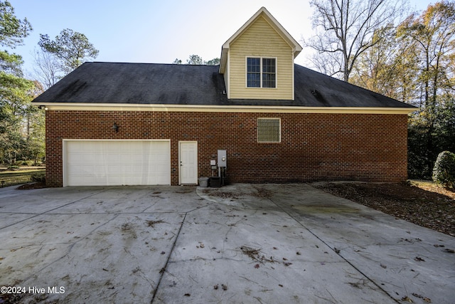 view of home's exterior with a garage