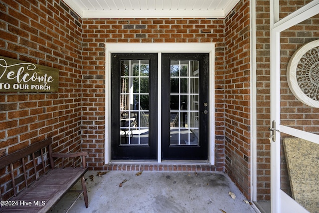 property entrance featuring french doors