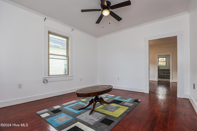 unfurnished room with crown molding, ceiling fan, and dark wood-type flooring