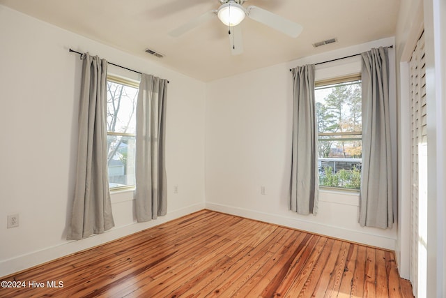 spare room featuring ceiling fan and wood-type flooring