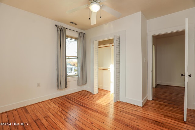 unfurnished bedroom with ceiling fan and light hardwood / wood-style floors