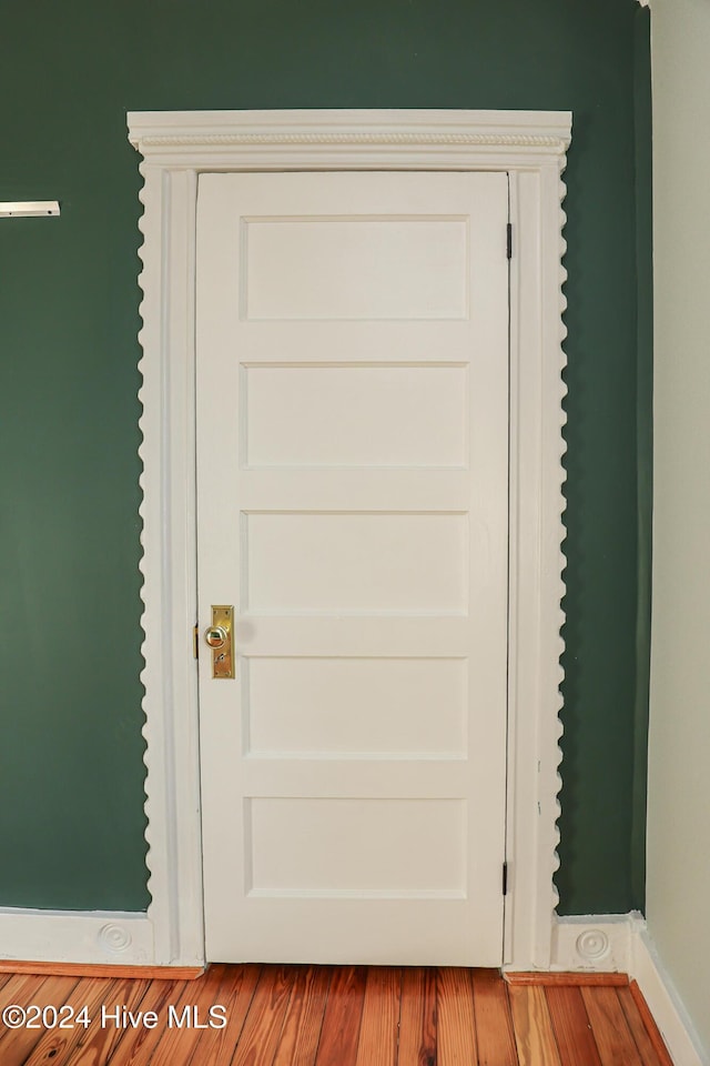 interior details with hardwood / wood-style flooring