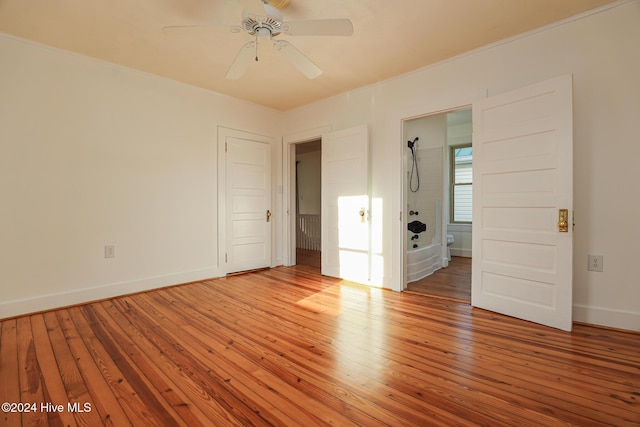 unfurnished bedroom with ceiling fan and light hardwood / wood-style floors