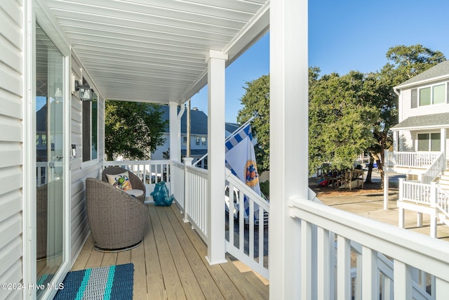 wooden terrace featuring a porch