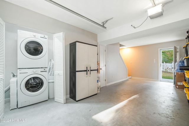 washroom featuring stacked washer / drying machine