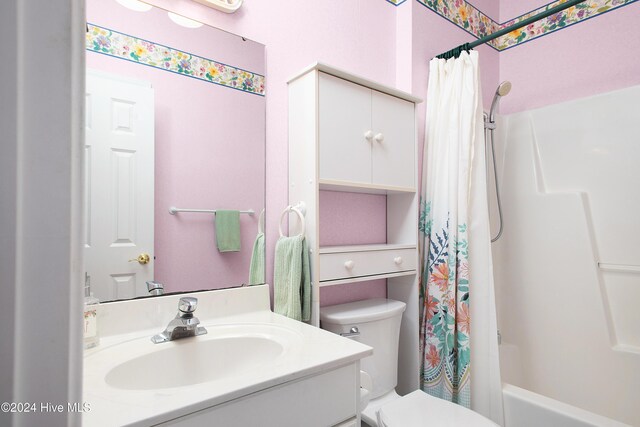 full bathroom with vanity, shower / bathtub combination with curtain, and toilet