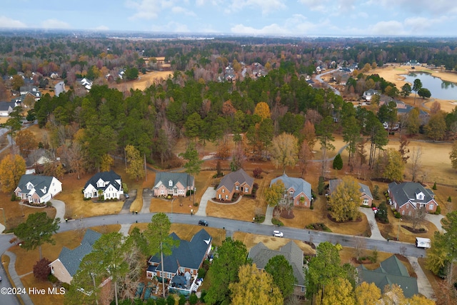 drone / aerial view featuring a water view and a residential view